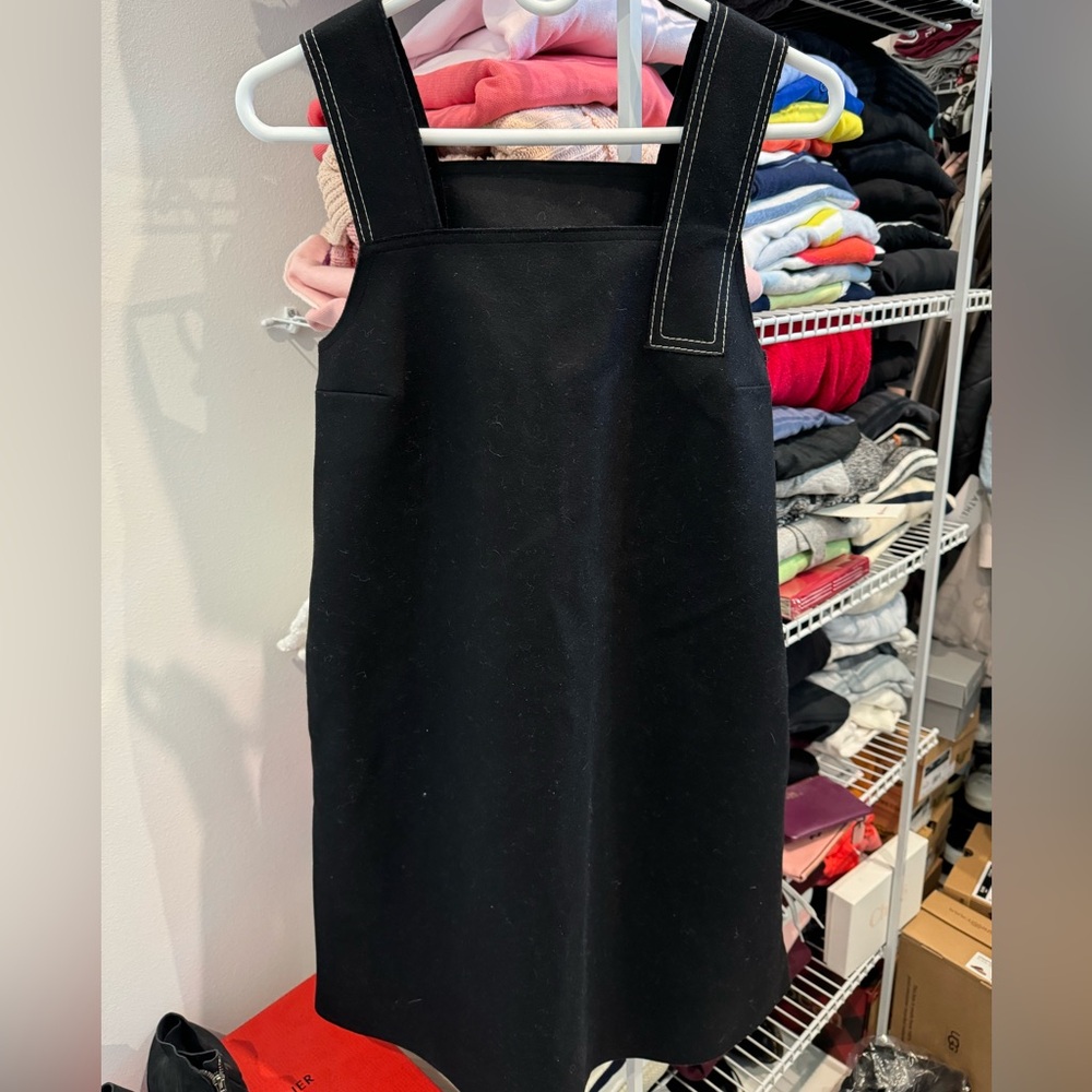 Women’s black, COS wool flannel dress with white stitching.